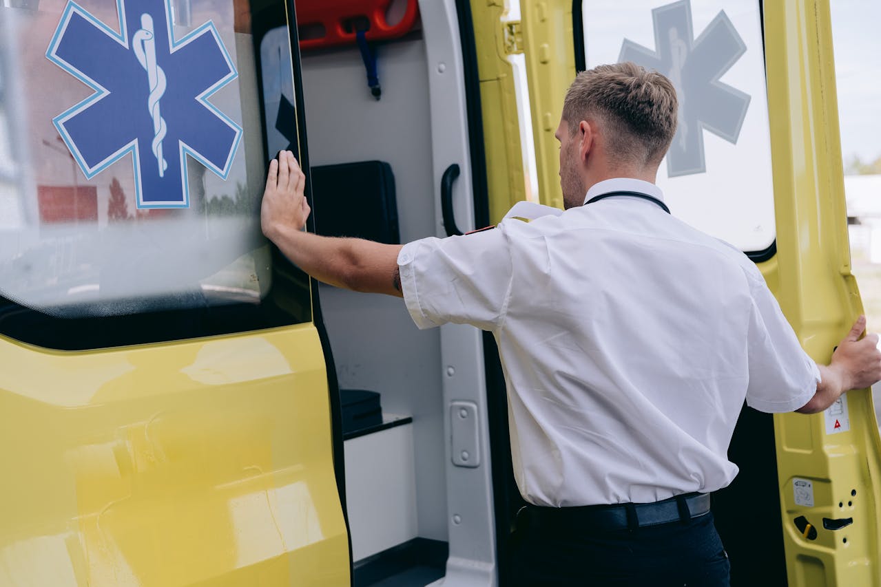 Photo by Mikhail Nilov: https://www.pexels.com/photo/man-opening-the-door-of-an-ambulance-8942050/