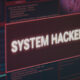Computer monitor showing hacked system alert message flashing on screen